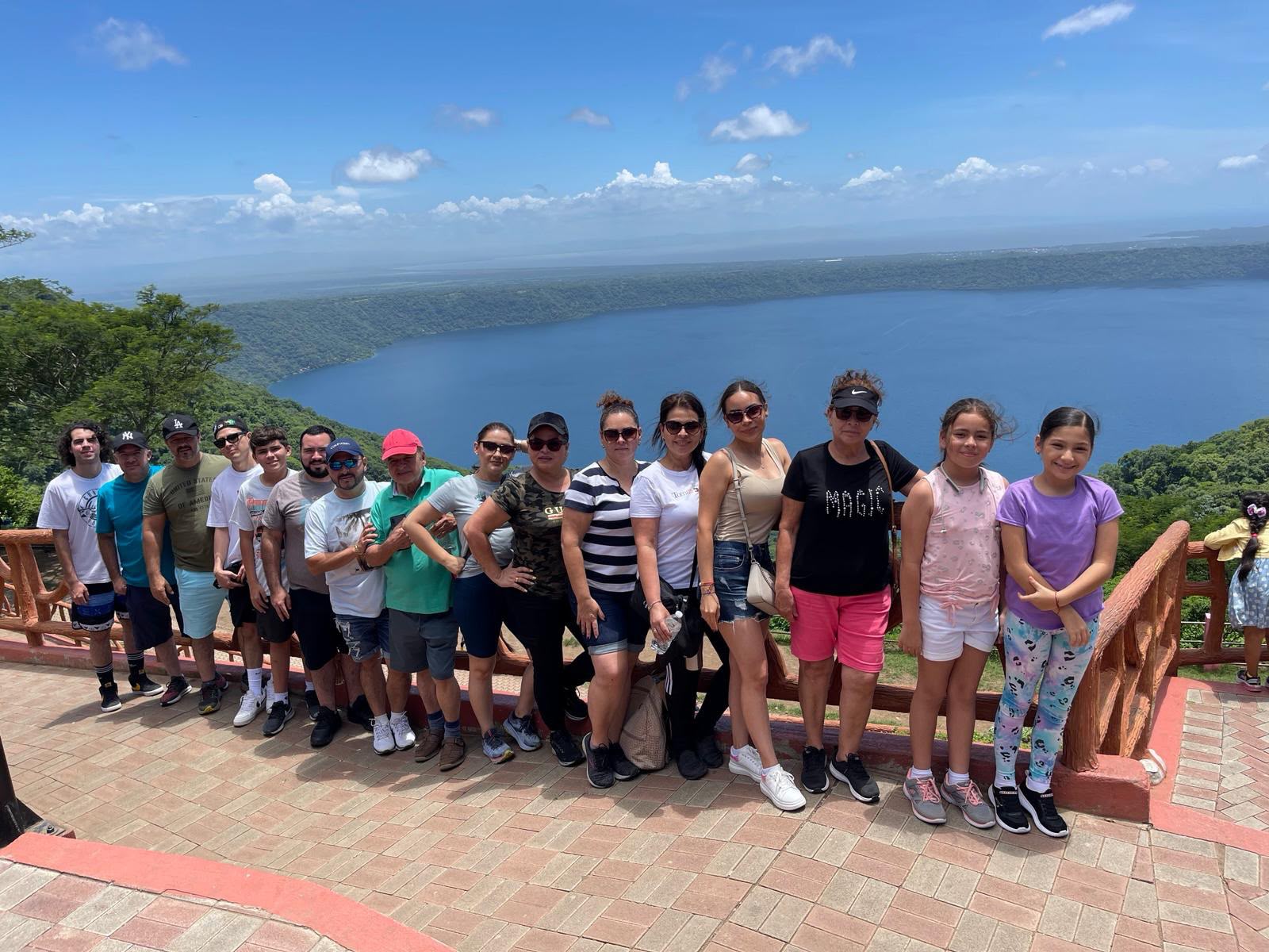 Group of travelers enjoying the view of a volcanic lake in Costa Rica