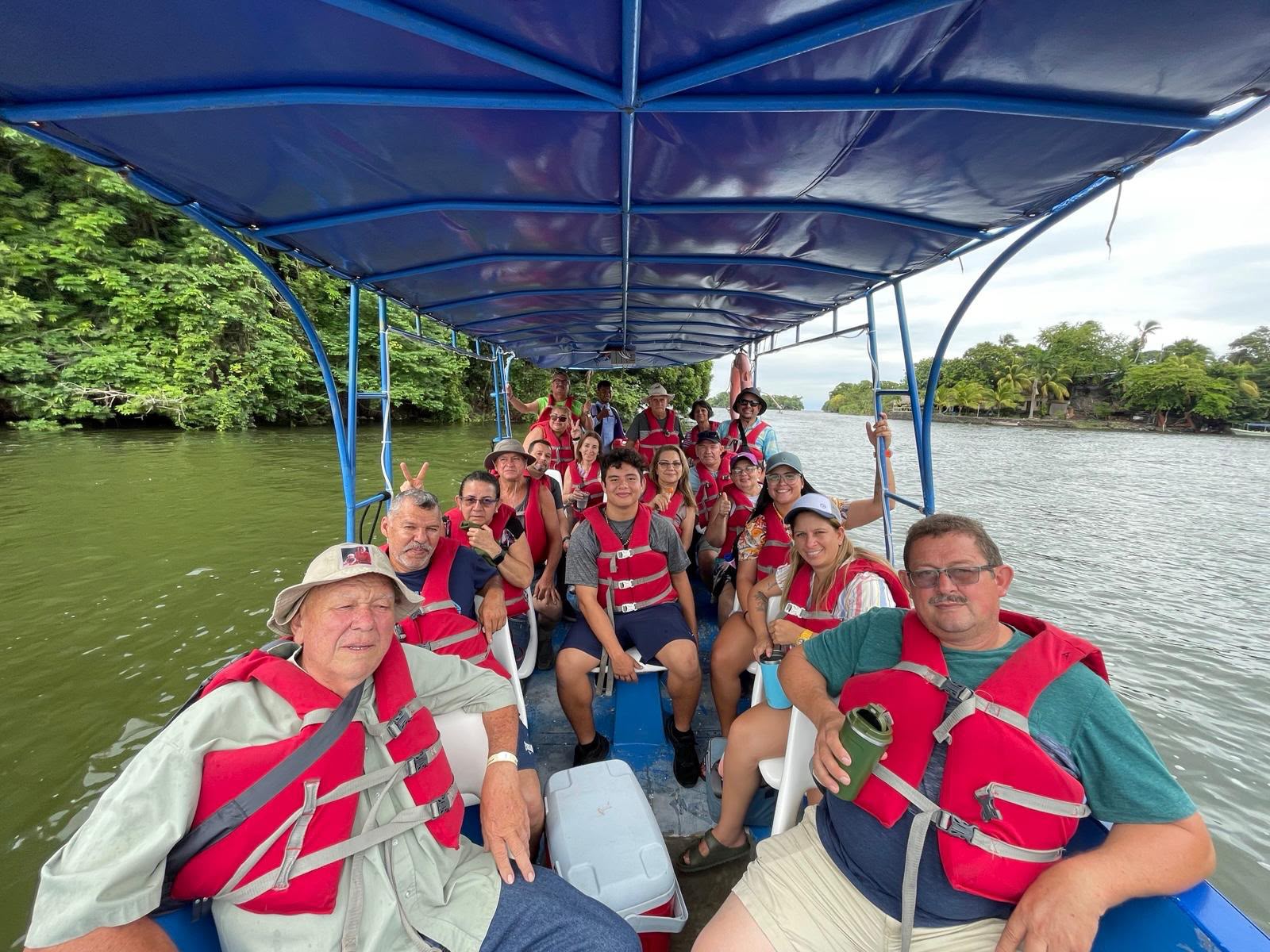 Group of travelers enjoying a boat excursion through Costa Rica's tropical waterways